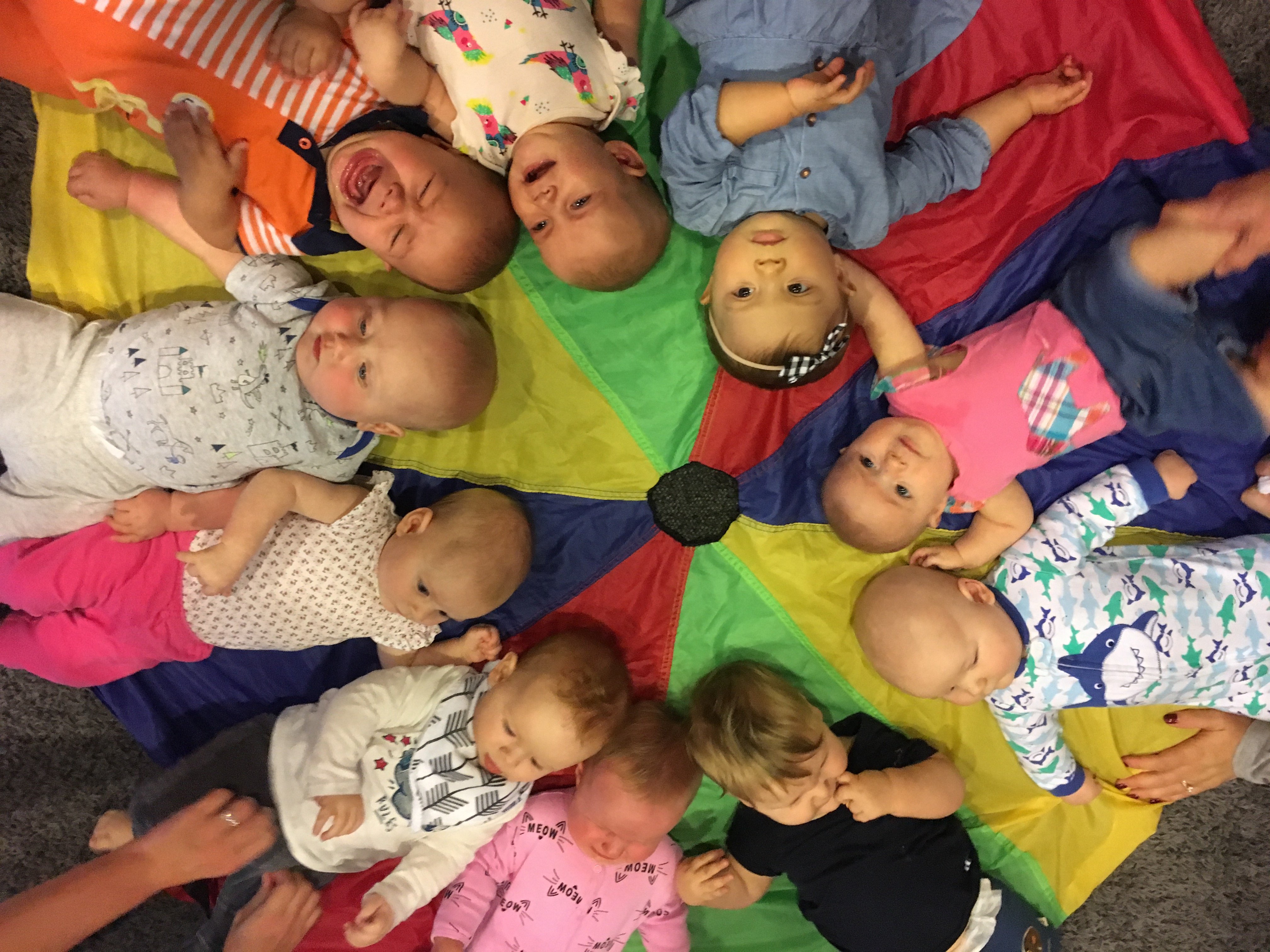 Babies in a circle during Mommy and Me class